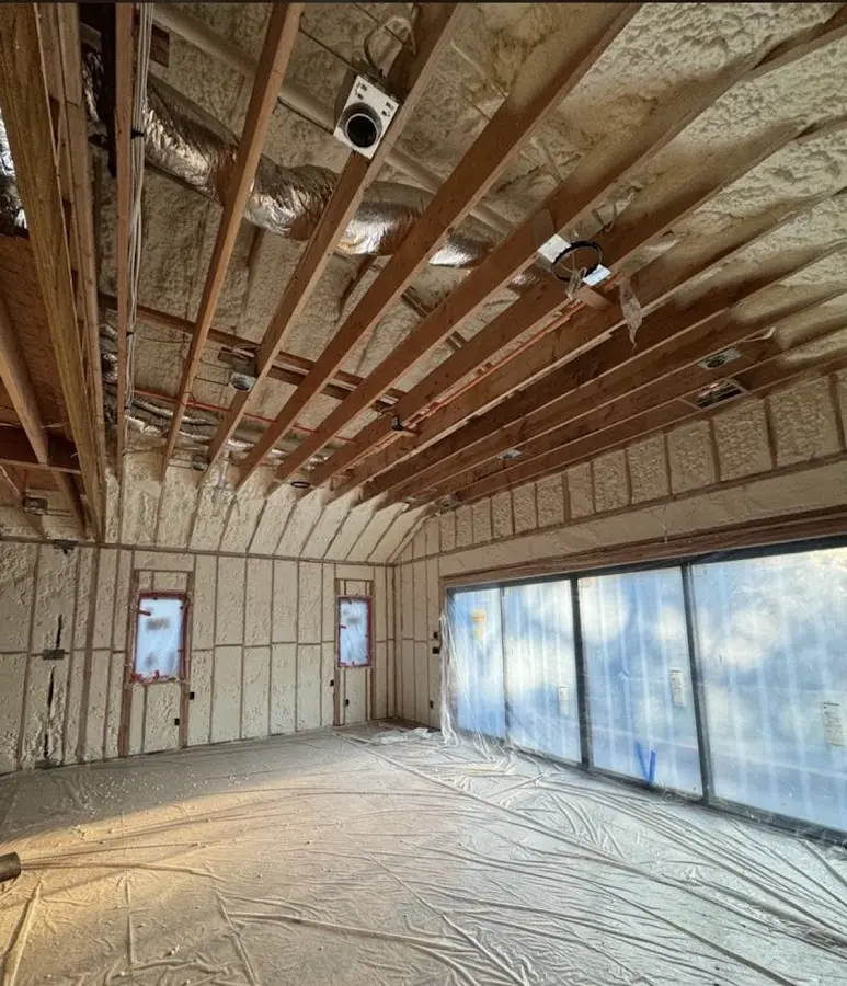 Interior walls and ceiling insulated with spray foam during new construction in East Rockaway